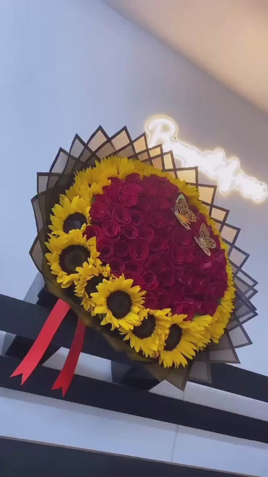 75 Red Roses with Ring of Sunflowers on Black Transparent Wrapping