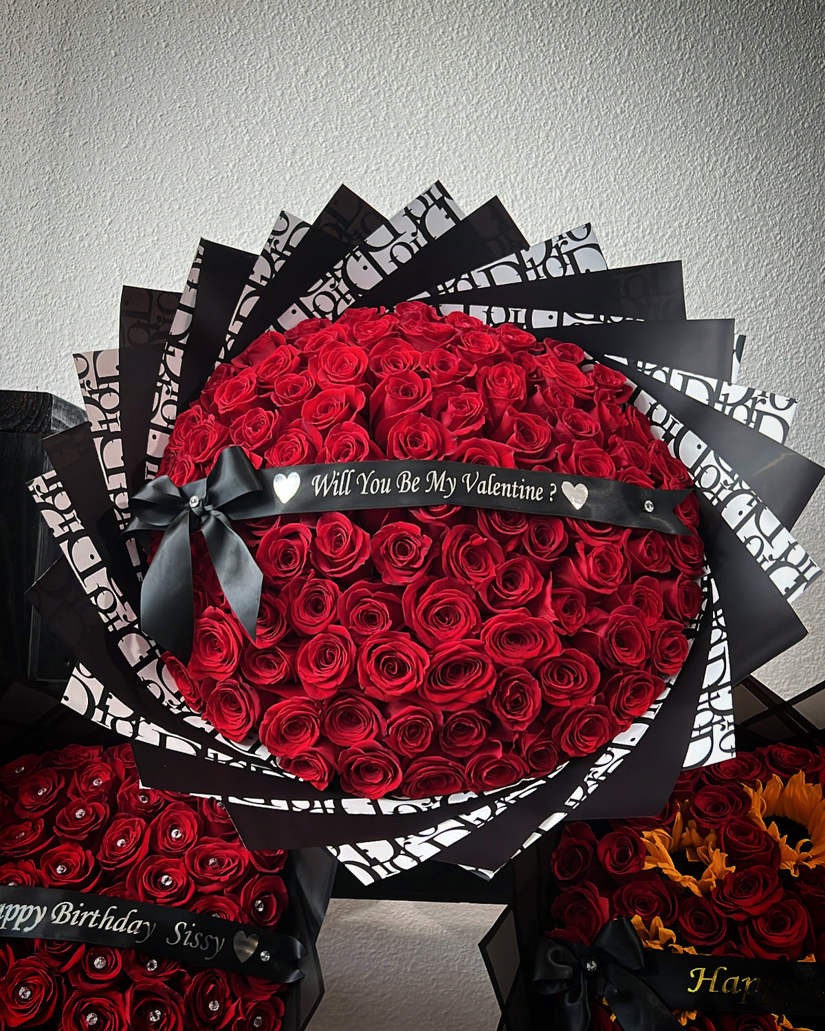 100 Red Roses with Black Dior Wrapping